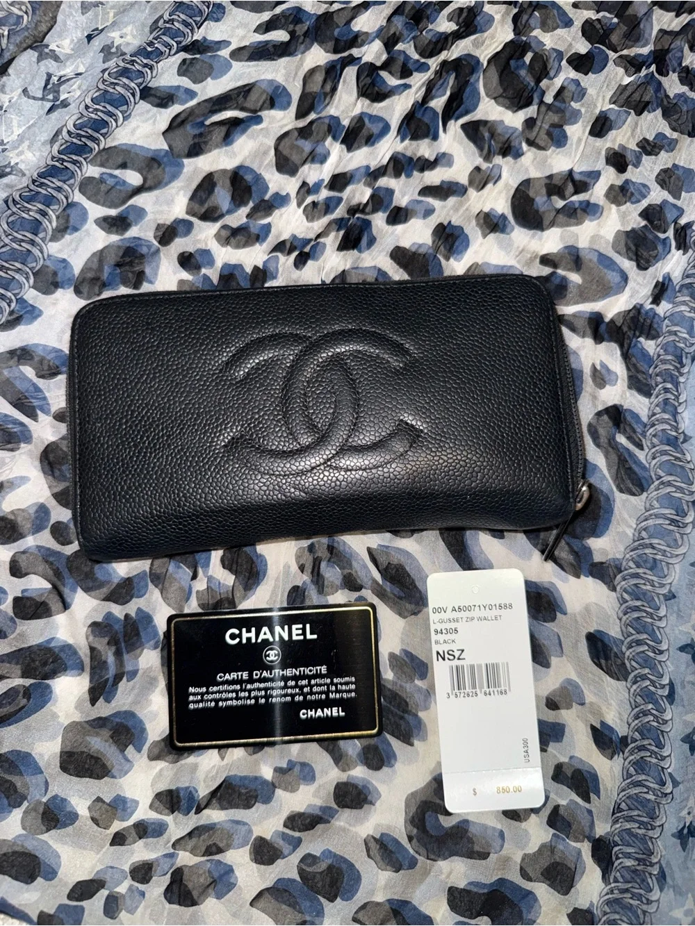 Authentic CHANEL Black Caviar Leather Zip-Around Wallet with Embossed CC